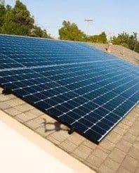 Person holding solar panel